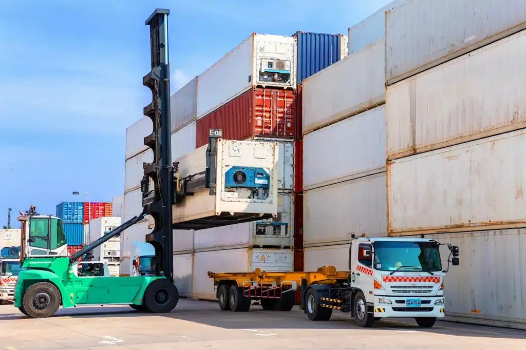 Truck With Containers Being Loaded Onto It